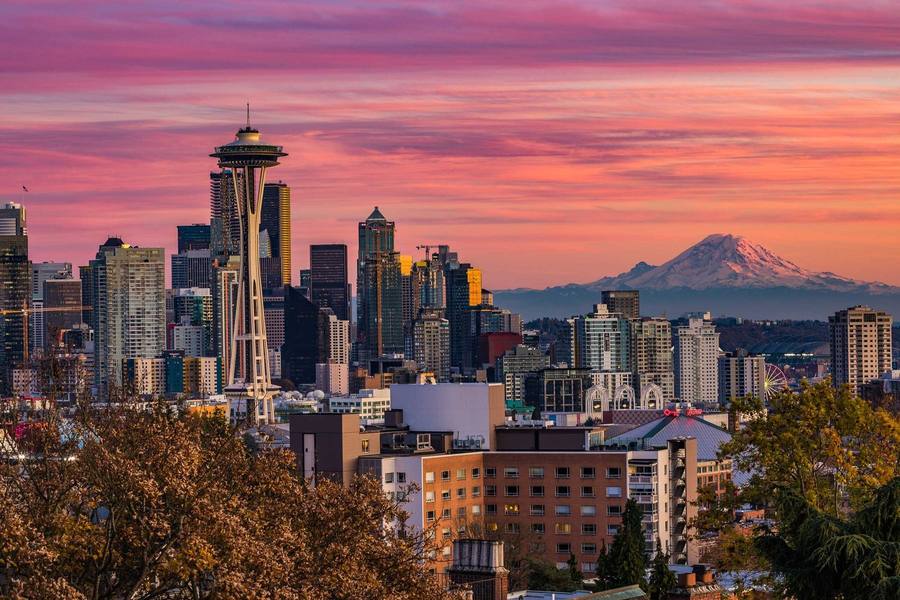 Seattle skyline and the Space Needle at sunset, with Mount Rainier behind